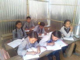 Children using their corrugated classroom